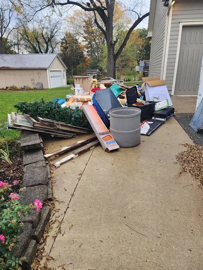 Dumpster being loaded with debris for Demolition Dumpster Rental in Newman